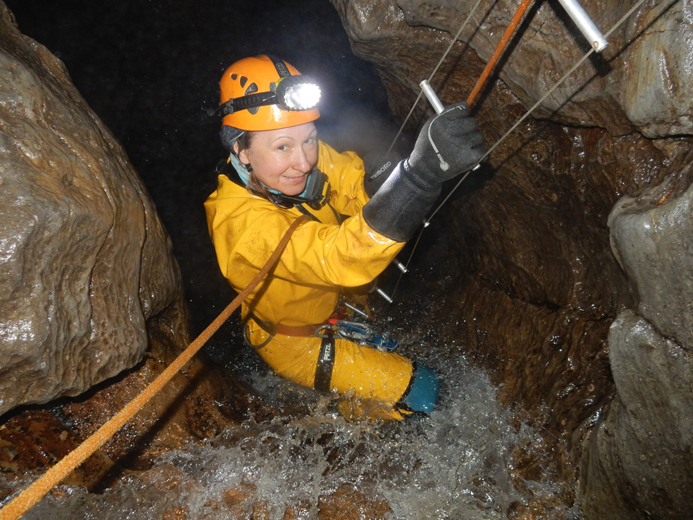 Climbing cave ladder in P8 Derbyshire